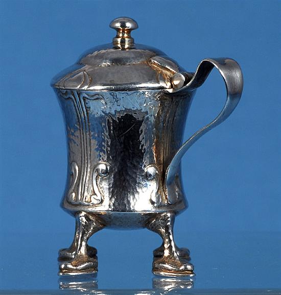 An Edwardian Arts and Crafts Cymric silver mustard pot, designed by Archibald Knox, for Liberty & Co, numbered 409, height 70mm,